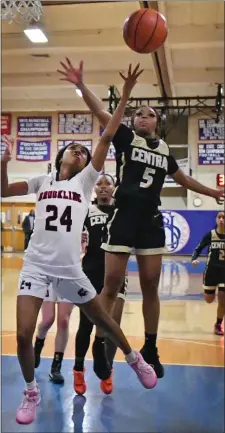  ?? CHRIS CHRISTO — BOSTON HERALD ?? Brookline’s Geanna Bryant goes up for a shot while being guarded by Springfiel­d Central’s Heaven Morris on Wednesday. The visitors eliminated Brookline, 65-52.