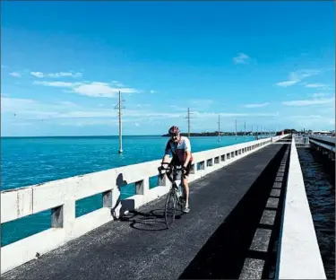  ??  ?? Biking in the Keys is especially fun on stretches where you don’t have to worry about riding next to traffic.