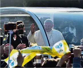  ??  ?? Papal blessing: Pope Francis, waving to the crowd in Milan, urged leaders to promote Europe’s ‘patrimony of ideals and spiritual values’.