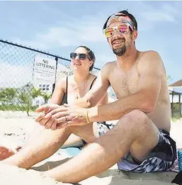  ?? Brian A. Pounds / Hearst Connecticu­t Media ?? Lindsey and Ed Plunge came all the way from Windsor Locks to enjoy an afternoon at Sound View Beach. Sound View Beach in Old Lyme is one of the few beaches in the state open to all people no matter where they are from.