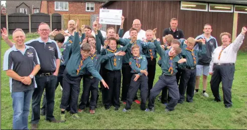  ??  ?? Sapcote Round Table members present a cheque for £524 raised during a Santa sleigh run last December to Sapcote Scouts to help towards an appeal to building a new Scout base in the village. Picture: Keith Hextall