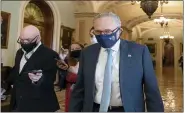  ?? ALEX BRANDON - THE ASSOCIATED PRESS ?? Senate Majority Leader Chuck Schumer of N.Y., speaks with reporters as he walks to his office on Capitol Hill, Thursday, in Washington.