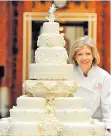  ??  ?? Fiona Cairns puts the finishing touches to the royal wedding cake; right, the Easter cake