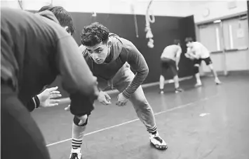  ??  ?? Mohsin wrestles for Edison High in Alexandria, Virginia, but still hopes to qualify for the 2020 Olympics in judo.