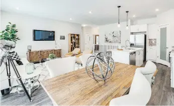  ??  ?? The Pines show home offers a pleasing open concept floor plan. The free-flowing great room, with premium barnboard-style laminate flooring, invites relaxed living and is ideal for entertaini­ng.