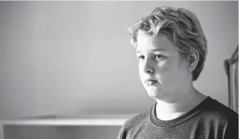  ?? Marie D. De Jesús / Staff photograph­er ?? Raymond Blair, 11, says he suffered from anxiety the first few months after Harvey every time it rained. The family home flooded after Harvey water was released from storm-swollen reservoirs.