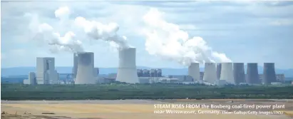  ?? (Sean Gallup/Getty Images/TNS) ?? STEAM RISES FROM the Boxberg coal-fired power plant near Weisswasse­r, Germany.