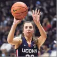  ?? Jessica Hill / Associated Press ?? UConn’s Caroline Ducharme shoots during the men’s and women’s annual First Night celebratio­n.