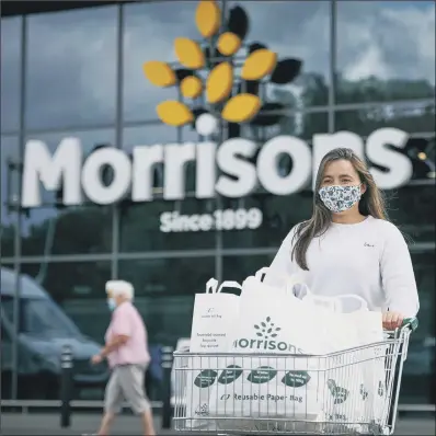  ?? PAPER CHASE: PICTURE: MIKAEL BUCK ?? Morrisons is to introduce paper bags which are reusable, recyclable, and water and tear resistant.