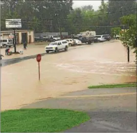  ?? SUBMITTED PHOTO ?? A reader submitted this photo of flooding on Route 100 at the intersecti­on with Ehst Road just outside Bechtelsvi­lle.