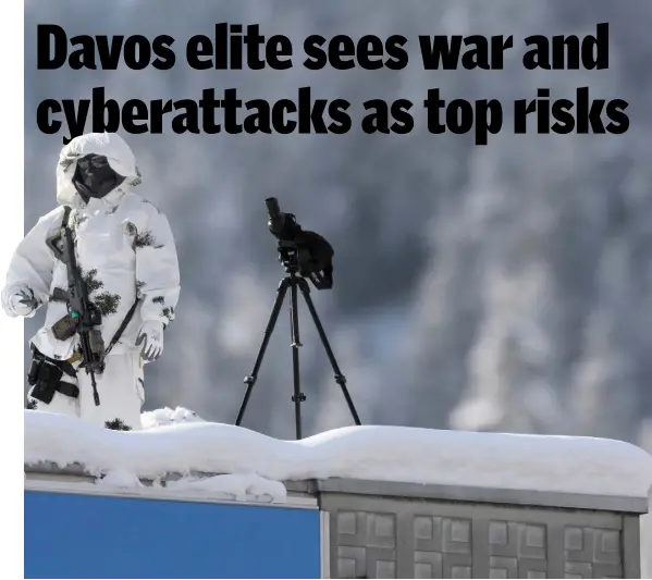  ??  ?? A police sniper secures a roof next to the Congress Centre on the eve of the opening day of the World Economic Forum in Davos last year