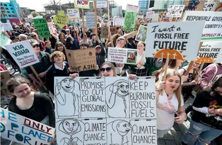  ??  ?? One of the many Strike for Climate Change demonstrat­ions in New Zealand in March. Martin van Beynen predicts the radical action required to keep climate change in check will not happen at a time of global power shifts ‘‘and the climate will inevitably warm’’.