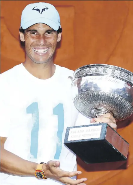  ?? CAMERON SPENCER/GETTY IMAGES ?? Spanish star Rafael Nadal captured his 11th French Open title Sunday in Paris, the 17th Grand Slam title of his storied career, with a 6-4, 6-3, 6-2 sweep of Austria’s Dominic Thiem.