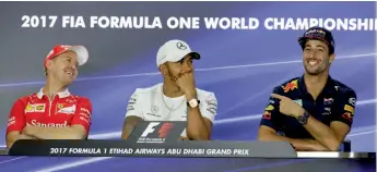  ?? — AP ?? Ferrari’s Sebastian Vettel ( from left), Mercedes’ Lewis Hamilton and Red Bull driver Daniel Ricciardo share a light moment at a news conference in Yas Marina racetrack in Abu Dhabi, UAE on Thursday.