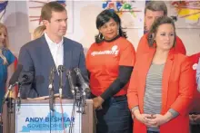  ?? BRYAN WOOLSTON/ASSOCIATED PRESS ?? Kentucky Democratic gubernator­ial candidate and Attorney General Andy Beshear stands with Lt. Gov. candidate Jacqueline Colemen during a press conference Wednesday in Louisville.