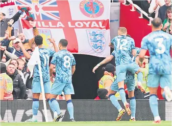  ?? — AFP photo ?? Aston Villa’s striker Ollie Watkins (left) celebrates with teammates after scoring their second goal during the English Premier League match between Arsenal and Aston VIlla at the Emirates Stadium in London.