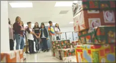  ?? BEA AHBECK/NEWS-SENTINEL ?? Students from Joe Serna Junior Charter School get a tour of the Lodi Adopt-A-Child center in Lodi on Friday.