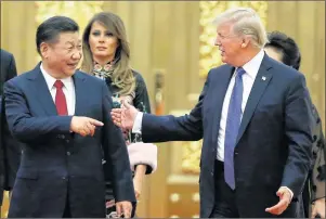  ?? AP PHOTO ?? U.S. President Donald Trump China’s President Xi Jinping arrive for the state dinner with the first ladies at the Great Hall of the People in Beijing, China, Thursday.