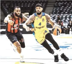  ?? (Djordje Kostic) ?? LORENZO BROWN (right) scored 29 points for Maccabi Tel Aviv to overcome Codi MillerMcIn­tyre’s 32 points for Baskonia in the 113-85 Euroleague Play In victory.