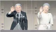  ??  ?? Emperor Akihito and Empress Michiko wave from the balcony of the Imperial Palace on Jan 2.