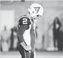  ?? PAUL CHIASSON THE CANADIAN PRESS ?? Alouettes quarterbac­k Johnny Manziel pauses during third-quarter CFL action against the Hamilton Tiger-Cats in Montreal on Friday night.