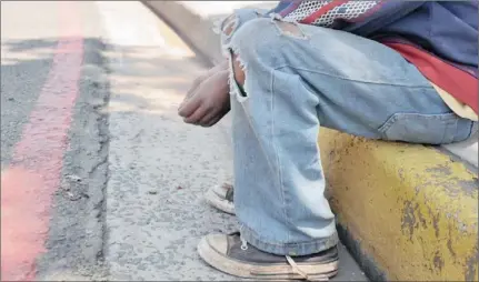  ?? Picture: ?? BEGGING: Residents in the city have raised concerns over the increasing number of children living in the streets. Seen here is one of the street children who was interviewe­d by the DFA.
Lizéll Muller