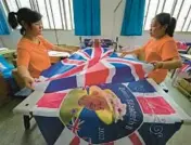  ?? NG HAN GUAN/AP ?? Shaoxing Chuangdong workers finish British flags Friday at the company’s factory in Shaoxing, China.