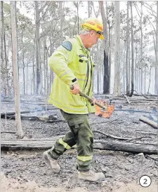  ?? Picture: AP ?? 2. Forestry Corporatio­n worker Dale McLean patrols a controlled fire as they work at building a containmen­t line at a wildfire near Bodalla, Australia on Sunday, January 12, 2020.