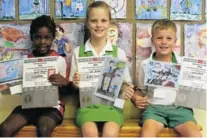  ?? Picture: AMANDA NANO ?? ‘HAPPY, GOOD AND PROUD’: Showing off their artworks are, from left, Sanele Katywa, Ella Bartlett and Daniel Smith