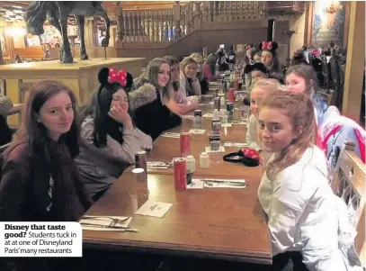  ??  ?? Disney that taste good? Students tuck in at at one of Disneyland Paris’ many restaurant­s