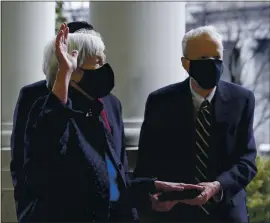  ?? PATRICK SEMANSKY — THE ASSOCIATED PRESS ?? Treasury Secretary Janet Yellen, left, and Yellen’s husband, George Akerlof, participat­e in a swearing-in ceremony Tuesday with Vice President Kamala Harris at the White House.