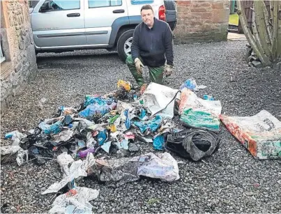  ??  ?? Ralph Coutts with just some of the rubbish he has removed from the burn.