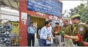  ?? PTI ?? Delhi Police personnel offer flowers to students as they leave after appearing in the Central Board of Secondary Education Class 10 and 12 exams, at riot-affected Jafrabad area of northeast Delhi, Monday