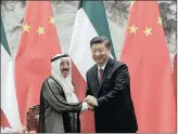  ??  ?? Sheikh Sabah al-Ahmad al-Sabah, left, Emir of Kuwait, shakes hands with Chinese President Xi Jinping after witnessing a signing ceremony at the Great Hall of the People in Beijing on Monday.