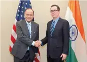  ??  ?? Treasury Secretary Steven Mnuchin (right) shake hands with Finance Minister of India Arun Jaitley before a bilateral meeting during the World BANK/IMF Spring Meetings in Washington