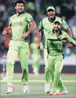  ?? Picture: GETTY IMAGES ?? KEY WICKET: Sohail Khan of Pakistan celebrates with Rahat Ali and Ahmad Shahzad of Pakistan after dismissing AB de Villiers of South Africa during their Cricket World Cup match at Eden Park in Auckland last night. Pakistan won by 29 runs.