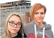  ??  ?? First-year pupil Hannah Taylor, 12, and mum Caroline outside fire-hit Woodmill High School in Dunfermlin­e