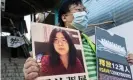  ?? Photograph: Miguel Candela/EPA ?? A pro-democracy activist holds up a signs in support of Chinese citizen journalist Zhang Zhan who has been sentence to four years in prison and the 12 arrested people in China in Hong Kong, China, 28 December 2020.