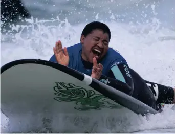  ??  ?? SURF JOY: Paraplegic participan­ts experience­d the thrill of riding a wave at South Africa’s first adaptive surfing championsh­ips recently.