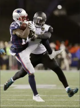  ?? DAVID J. PHILLIP — ASSOCIATED PRESS ?? Patriots wide receiver Phillip Dorsett makes a catch while Jaguars linebacker Myles Jack defends during the AFC championsh­ip game on Jan. 21 in Foxborough, Mass.