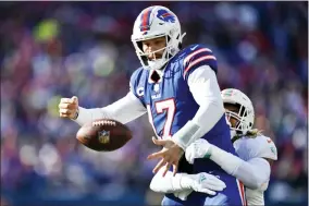  ?? ADRIAN KRAUS — THE ASSOCIATED PRESS ?? Buffalo Bills quarterbac­k Josh Allen (17) is hit by Miami Dolphins linebacker Duke Riley (45) during the first half of an NFL wild-card playoff football game, Sunday, Jan. 15, 2023, in Orchard Park, N.Y.