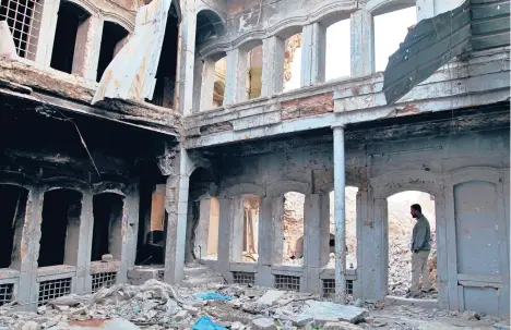  ?? KULLAB/AP SAMYA ?? A house remains in ruins in the Old City section of Mosul — three years after forces defeated the Islamic State in Iraq’s second-largest city.