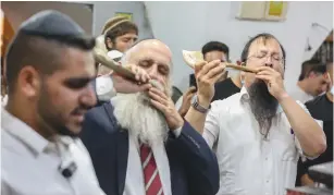  ?? ( David Cohen/ Flash90) ?? BLOWING THE shofar during a Slihot service in Meron last month.