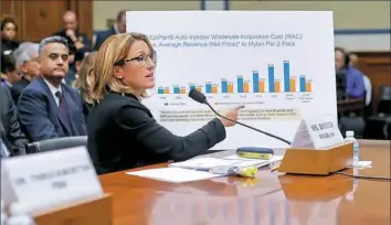  ?? Pablo Martinez Monsivais/Associated Press ?? Mylan CEO Heather Bresch points to a chart to help her answer questions while testifying Wednesday on Capitol Hill in Washington.