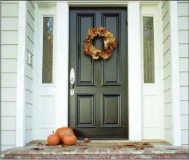  ?? Metro Creative Graphics ?? A simple wreath made of fall leaves on the front door, with a few pumpkins on the stoop, make a simple, but beautiful, exterior upgrade for the season.