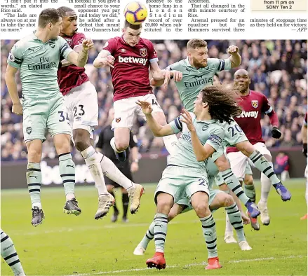  ?? — AP ?? West Ham’s Declan Rice (centre) tries to head the ball at the goal in their English Premier League match against Arsenal at the London Stadium on Saturday. West Ham won 1-0.