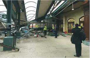  ?? (Reuters) ?? A NEW JERSEY TRANSIT train that derailed and crashed through the station is seen in Hoboken yesterday.