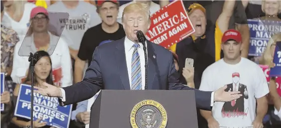  ?? AP PHOTOS ?? HARDCORE CORE: President Trump exhorts rabid supporters at a rally yesterday in Huntington, W.Va., after news broke about a new grand jury in the Russia probe.