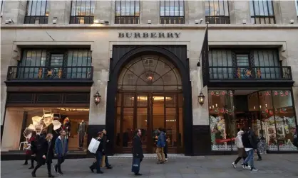  ?? Photograph: Niklas Halle’n/AFP/Getty ?? Pedestrian­s pass the Burberry store on Regent Street in central London.