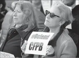  ?? Jacquelyn Martin Associated Press ?? SALLY GREENBERG, head of the National Consumers League, supports the Consumer Financial Protection Bureau during a rally in November 2017.